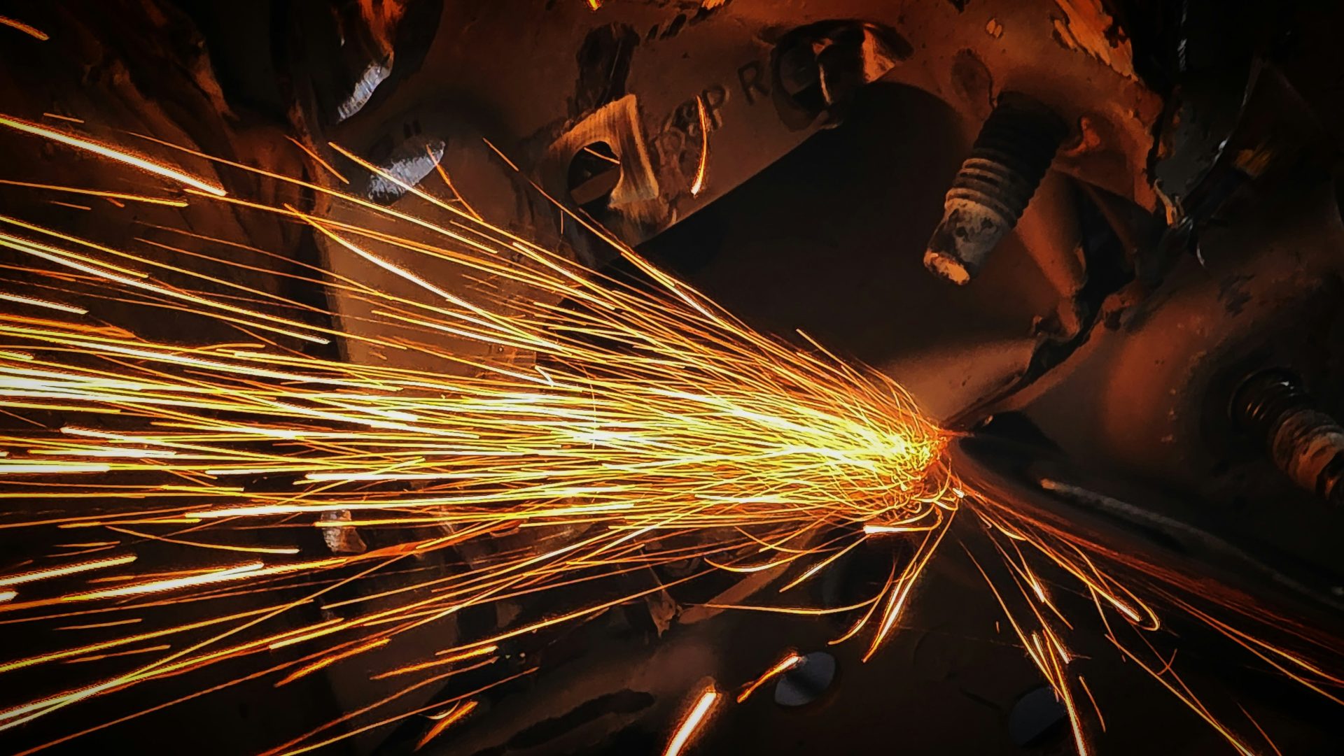 Sparks fly during metal welding or cutting.