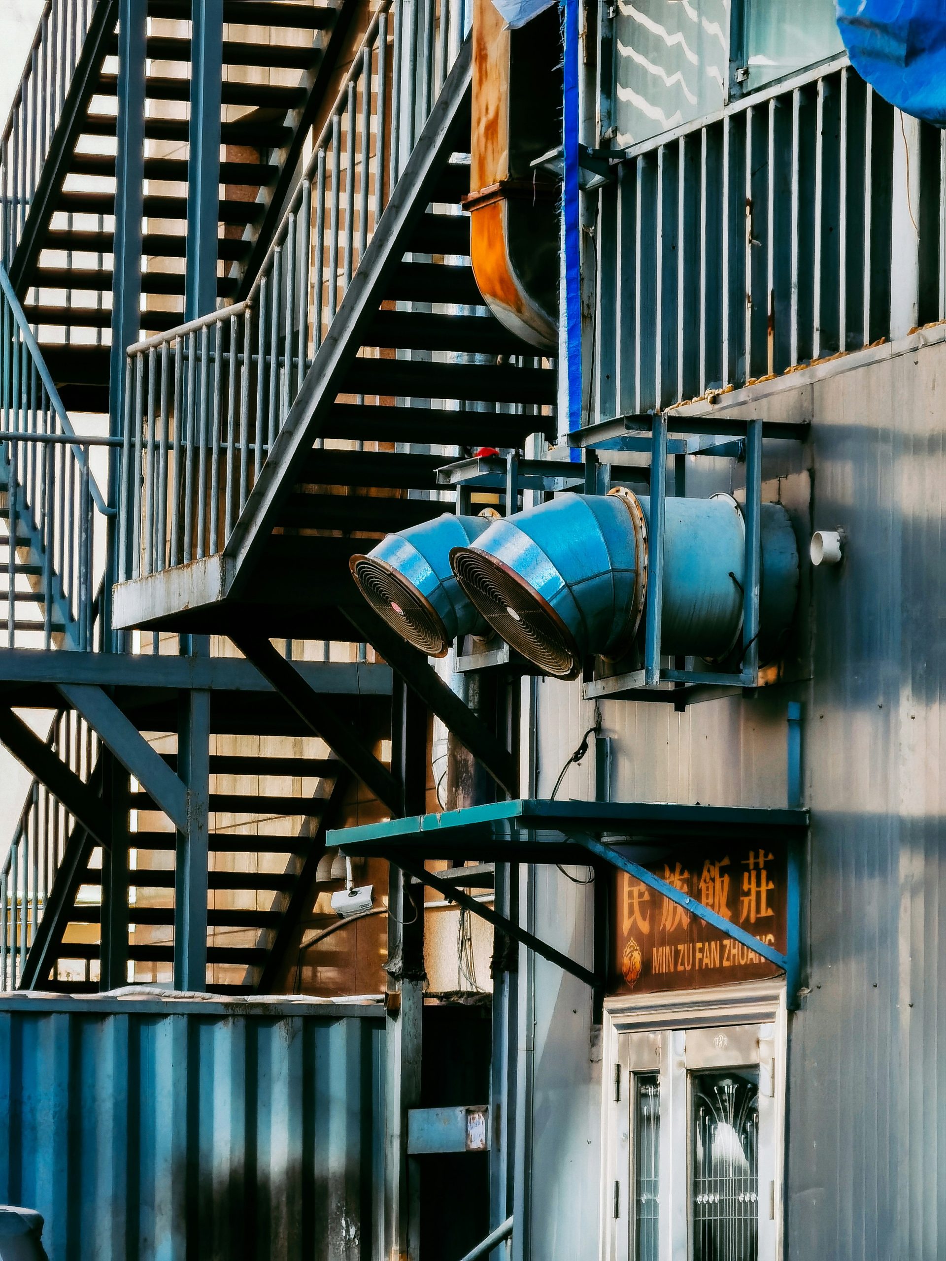 green and blue metal staircase